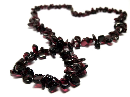 Isolated purple garnet necklace heart shaped on white backgroundの写真素材