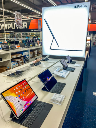 Darmstadt, Germany - September 16th 2020: A German photographer visiting Loop5, the biggest shopping mall in Hesse, taking pictures of the new iPad Pro Pro from Apple.のeditorial素材