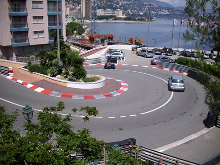 Monaco, Monte Carlo - 15th May 2018: A german photographer visiting the French Riviera, having a one-day trip to Monaco, taking pics of the most famous curve of the formula one track of Monaco.のeditorial素材