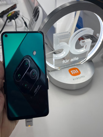 Frankfurt, Germany - 4th October 2021: A german photographer visiting a Saturn market, seeking information about the all new Xiaomi Mi Note 10 Pro 5G smartphone.のeditorial素材