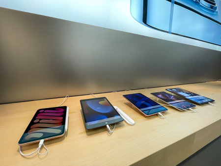 Cologne, Germany - September 30th 2021: A German photographer visiting an Apple Store, comparing...