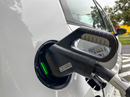 Limburg, Germany - 30th September 2021: A german photographer testing an electric car, loading it at a parking lot at the highway 3.のeditorial素材