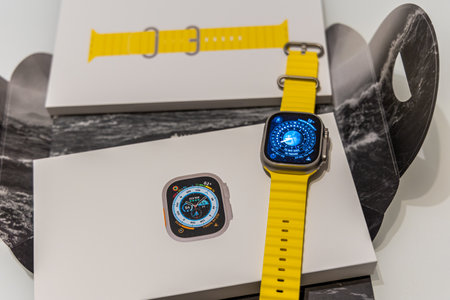 Frankfurt, Germany - October 12th 2022: A german photographer bought the new Apple Watch Ultra in an Apple Store, installing an initiating it at home.のeditorial素材
