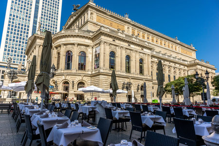 Frankfurt, Germany - September 30th, 2022: Photographer visiting Frankfurt, exploring the old opera and its surroundings on a cold but sunny day in Autumn.のeditorial素材