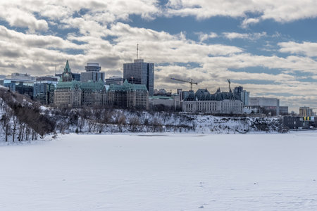Ottawa, Canada - February 08th 2023: A german photographer discovering Majors Hill Park in downtown Ottawa with view to the historical buildings.のeditorial素材