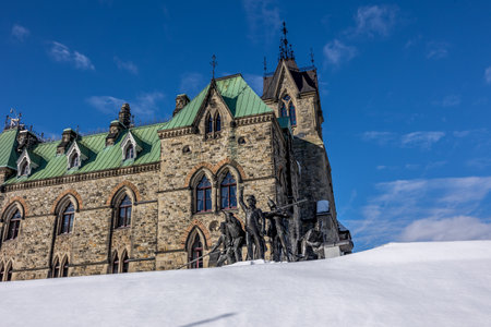 Ottawa, Canada - February 08th 2023: A german photographer discovering Majors Hill Park in downtown Ottawa with view to the historical buildings of the Canadian parliament.のeditorial素材