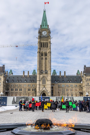 Ottawa, Canada - February 08th 2023: Black religious people demonstrating for their rights in front of the historical buildings of the Canadian parliament.のeditorial素材