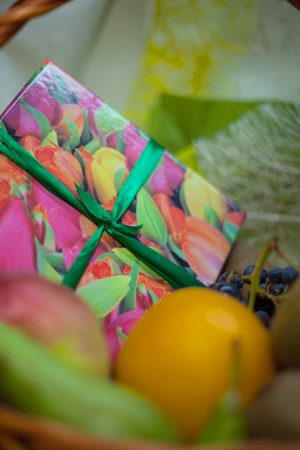 Gift box in the cart with apple, orange, pearの写真素材