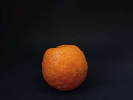 Orange fruit on black backgroundの写真素材