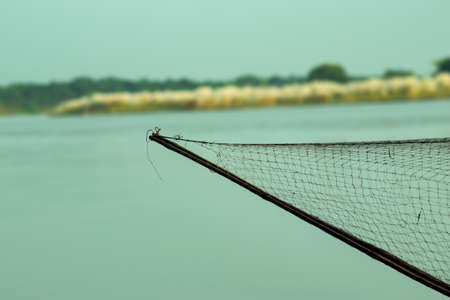Fishing net prepare and caught fish on the Gorai river with a boatの写真素材