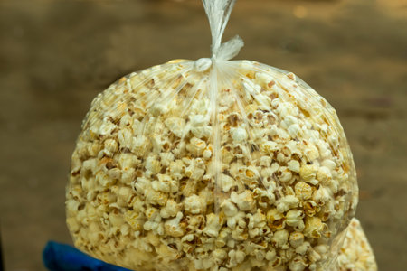 Popcorn into polythene bag that is from maize or popped corn, popcorns or pop-corn is a variety of...