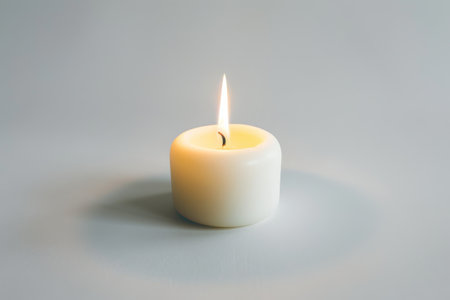 White candle isolated on white backgroundの素材