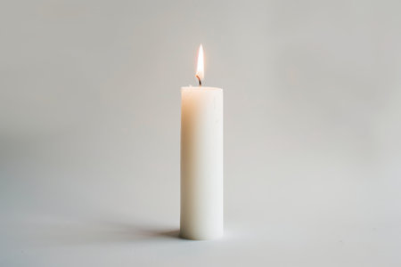 White candle isolated on white backgroundの素材