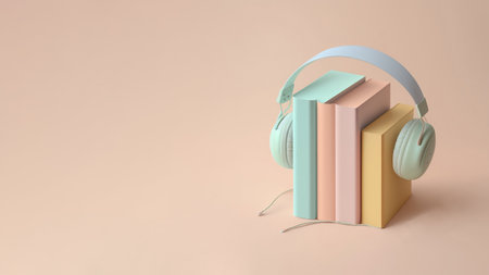 Audiobook concept. Headphones and books in pastel colors on the table.の素材