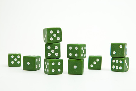 Group of green dices isolated on white backgroundの写真素材