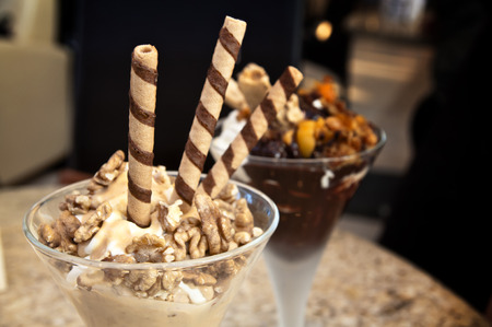 Walnut sundae - ice cream with topping at a cafe. Sweet moment.の写真素材