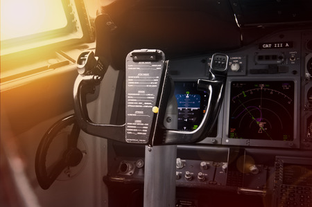 Modern jet airliner plane with glass cockpit at sunsetのeditorial素材