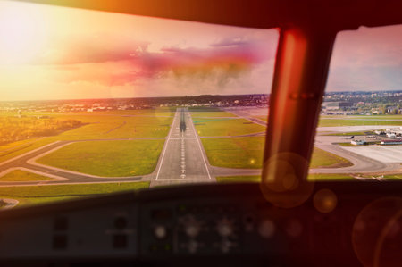 Final approach at sunset - view from the flight deckの写真素材