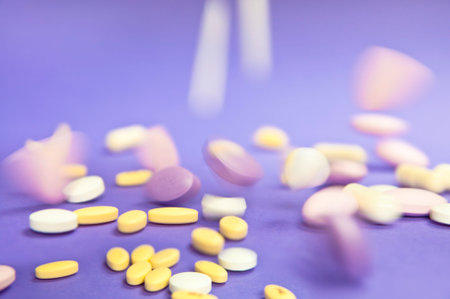 Lots of medical pills falling down on purple blue background