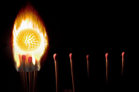 Social distancing concept - matches and virus on fire