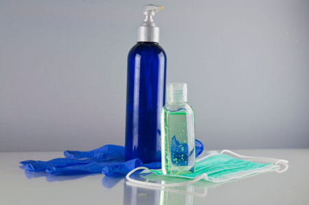 Disinfection liquids, face mask and disposable glove - pandemics precaution concept
