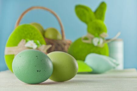 Happy Easter! Studio shot of Easter decorations and eggs on blue backgroundの写真素材