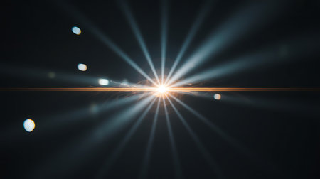 A captivating image featuring a bright and intense starburst of light against a dark almost black backdrop The light emanates from a central point creating a radiating pattern with well defined beams A distinct lens flare adds a horizontal streak of warm orange across the image enhancing the ethereal quality Soft bokeh like orbs are scattered adding depth and visual interest to the overall composition This high contrast image evokes a sense of wonder energy and the interplay between light and shadowの素材