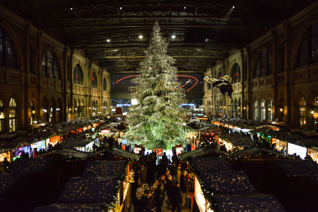 ZURICH, SWITZERLAND - NOVEMBER 2017 - Traditional christmas tree on christmas market on Zurich main train stationのeditorial素材