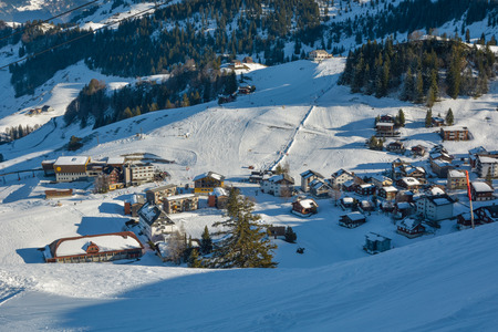 STOOS, SWITZERLAND - JANUARY 2018 - Small car free village of Stoos in Switzerland. Stoos is also popular ski resort. On left is top station of world's steepeest funicularのeditorial素材