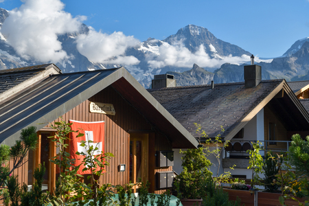 Murren, Switzerland - August 15, 2018: Wooden houses in idylic mountain village of Murren in canton of Bern, Switzerland during summer season 2018のeditorial素材