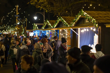 Bern, Switzerland - December 1, 2018: People visting traditional christmas market in Bern, Switzerland in the evening after sunset during December 2018のeditorial素材