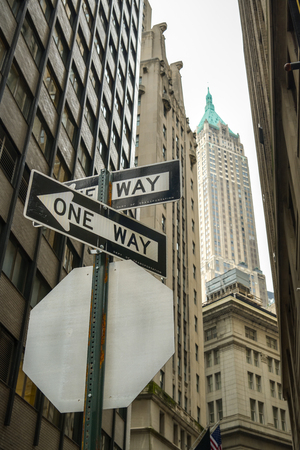 New York City, USA - October 4, 2018: Traffic signs in narrow street near Wall Street in New York City during October 2018のeditorial素材
