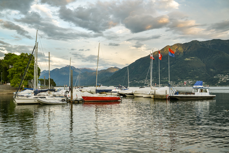 Locarno, Switzerland - September 1, 2018: Small boats on Lago Maggiore in Locarno, Switzerland during summer eveningのeditorial素材
