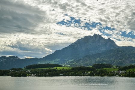 Lake Lucerne and Pilatus peak in Switzerland during dramatic weatherの写真素材