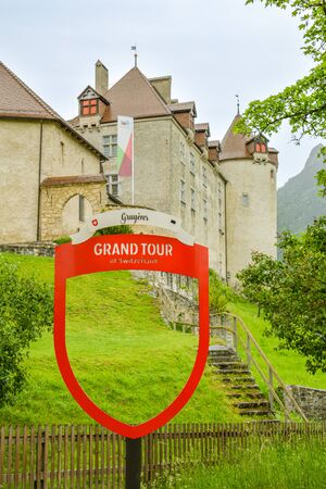 Gruyeres, Switzerland - June 9, 2019: Grand Tour of Switzerland label marking another important point on the route: Castle Gruyeres in Gruyeres, Switzerland during day in June 2019のeditorial素材