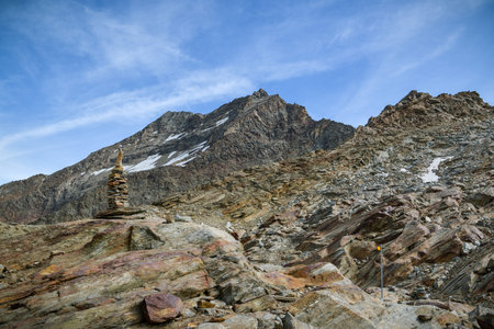 Small rock tower with majestic peaks in background close to Hohsaas above the Saas-Grund village,...