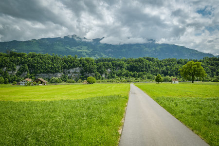 Countryside road leading to Wichelsee lake close to Sarnen in Switzerland