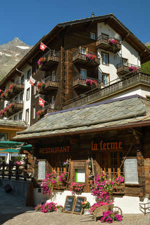 Saas-Fee, Switzerland - August 18, 2019: Cosy restaurant and hotel in Saas-Fee, Switzerland during beautiful sunny day in summer 2019のeditorial素材