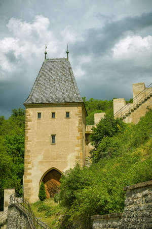 Karlstejn, Czech Republic - June 21, 2019: Tower with gate of Royal castle of Karlstejn, Czech Republic during beautiful day in June 2019のeditorial素材