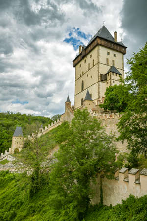 Karlstejn, Czech Republic - June 21, 2019: The main tower or Royal Castle of Karlstejn, Czech Republic during cloudy day in June 2019のeditorial素材