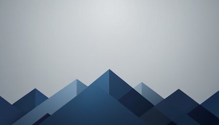 A stylized abstract background featuring layered geometric shapes in shades of blue, resembling mountain peaks. The shapes are arranged in a staggered pattern across the bottom of the frame, with a gradient from dark blue to lighter blues. The background transitions to a soft grey gradient at the creating a sense of depth and space.の素材