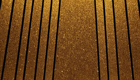 A close-up view of a background featuring vertical stripes of golden glitter. The glitter is densely packed, creating a sparkling and shimmering effect across the golden areas. Thin black lines separate the golden stripes, providing a stark contrast and defining the pattern.の素材
