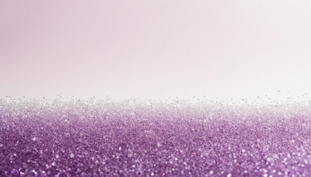 captures a wide, horizontal expanse of shimmering purple glitter that stretches across the lower half of the frame. The fine particles catch the light, creating a continuous, sparkling texture. The upper portion of the a soft gradient of pale pink, transitioning to a lighter shade towards the evoking a gentle sky. The overall effect is serene and with a focus on the interplay of light and texture. The composition is clean and minimalist, various applications.の素材