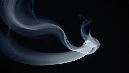 A abstract featuring delicate white and grey smoke gracefully swirling and forming curves against a stark, deep black background. The translucent wisps of smoke are illuminated subtly, creating a sense of ethereal movement and delicate form. The contrast between the light smoke and the dark background emphasizes the fluid and organic nature of the vapor. evokes a feeling of mystery and tranquility, making it a versatileの素材