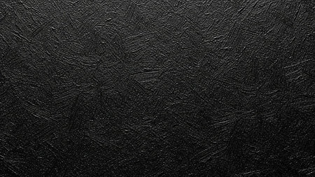 A detailed view of a deep black textured surface characterized by prominent, rough brush strokes. The impasto effect creates a sense of depth and dimension, with the textured layers appearing sculpted and organic. This abstract pattern offers a bold and expressive visual artistic or industrial applications. The subtle variations in the strokes add visual interest.の素材