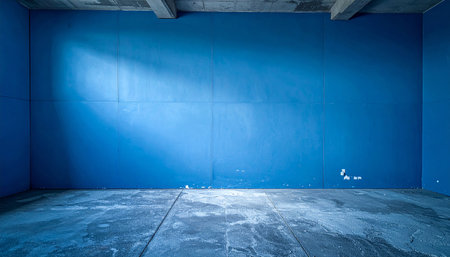 interior of empty room with blue wall and concrete floor, industrial backgroundの素材