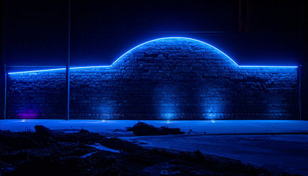 Blue neon light on a brick wall in a dark room. Abstract backgroundの素材