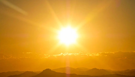 Sunset on the top of the mountain in the rays of the setting sunの素材