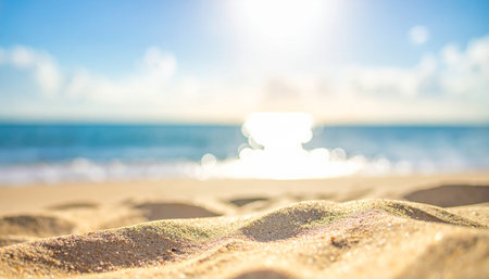 Blur tropical beach with bokeh sun light wave abstract backgroundの素材