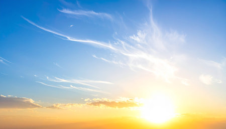 Sunset sky background with tiny clouds and blue sky. Nature background.の素材